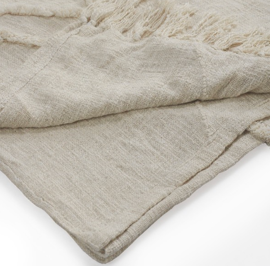 Beige textured blanket.