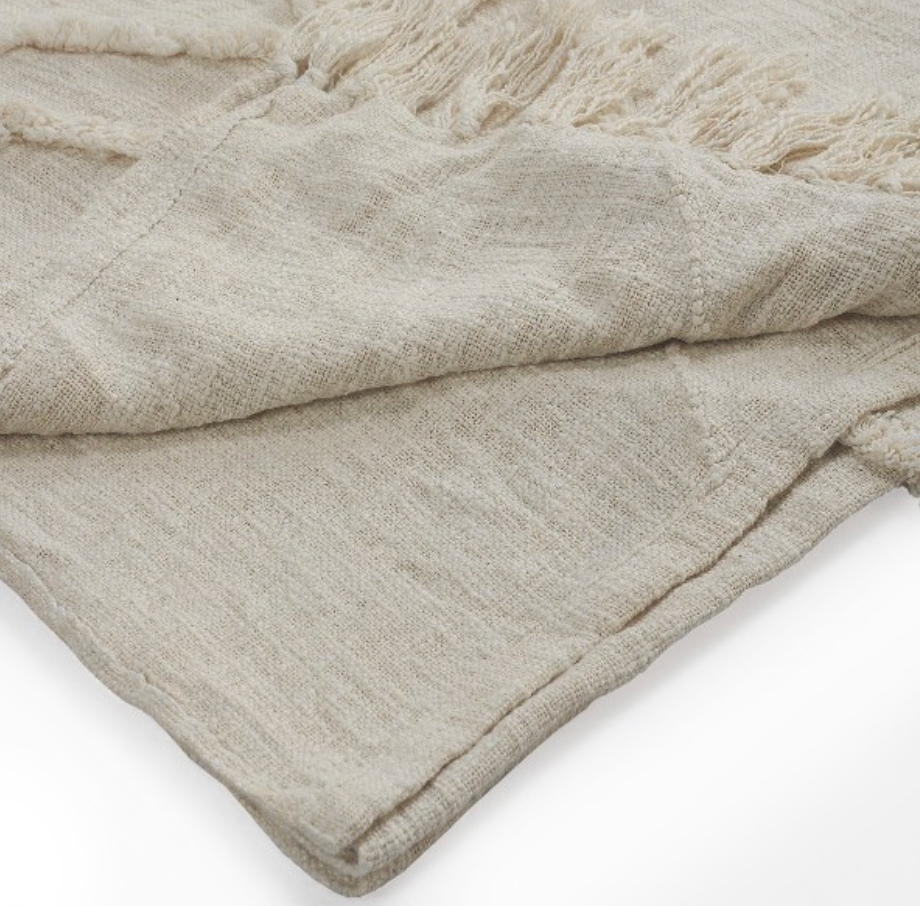 Beige textured blanket.