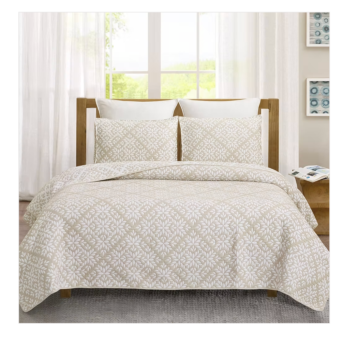 Bed with floral-patterned bedding.