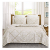 Bed with floral-patterned bedding.