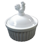 A white ceramic lidded dish with a fluted base and a rooster-shaped handle on top.