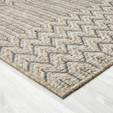 Textured woven rug with a geometric pattern.