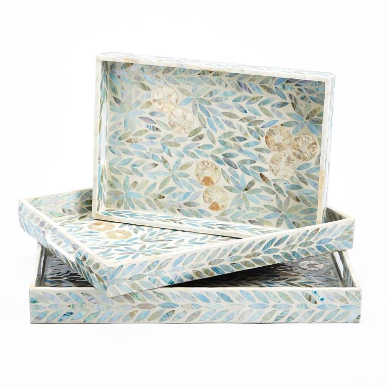 A set of three rectangular trays with a floral pattern and mother of pearl design, in shades of blue and white.