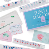 Travel mahjong set with packaging and components.
