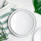 A white round melamine bamboo salad plate with a bamboo pattern border.