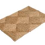 Made from hand-pulled seagrass, which is dried in the sun, braided into long, golden strands, and constructed into one-foot squares, this rug is completely handmade. Crafted by skilled artisans using traditional techniques passed down through generations.