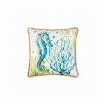 Square decorative throw pillow featuring a watercolor-style blue seahorse and coral reef, finished with a natural tan jute border.