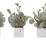 Three artificial eucalyptus arrangements in marbled white ceramic cubes, displayed side by side.