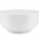 A white, round, melamine serving bowl .
