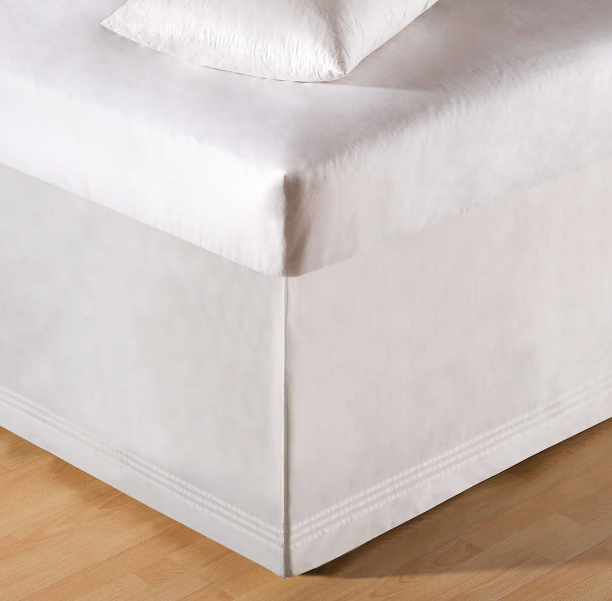 White bed sheet corner .