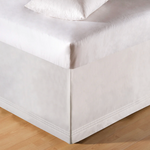 White bed sheet corner .