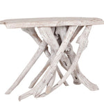 Driftwood side table with a white-washed finish .