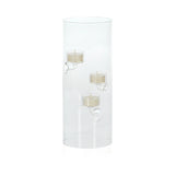 Clear cylindrical candle holder with three candles.