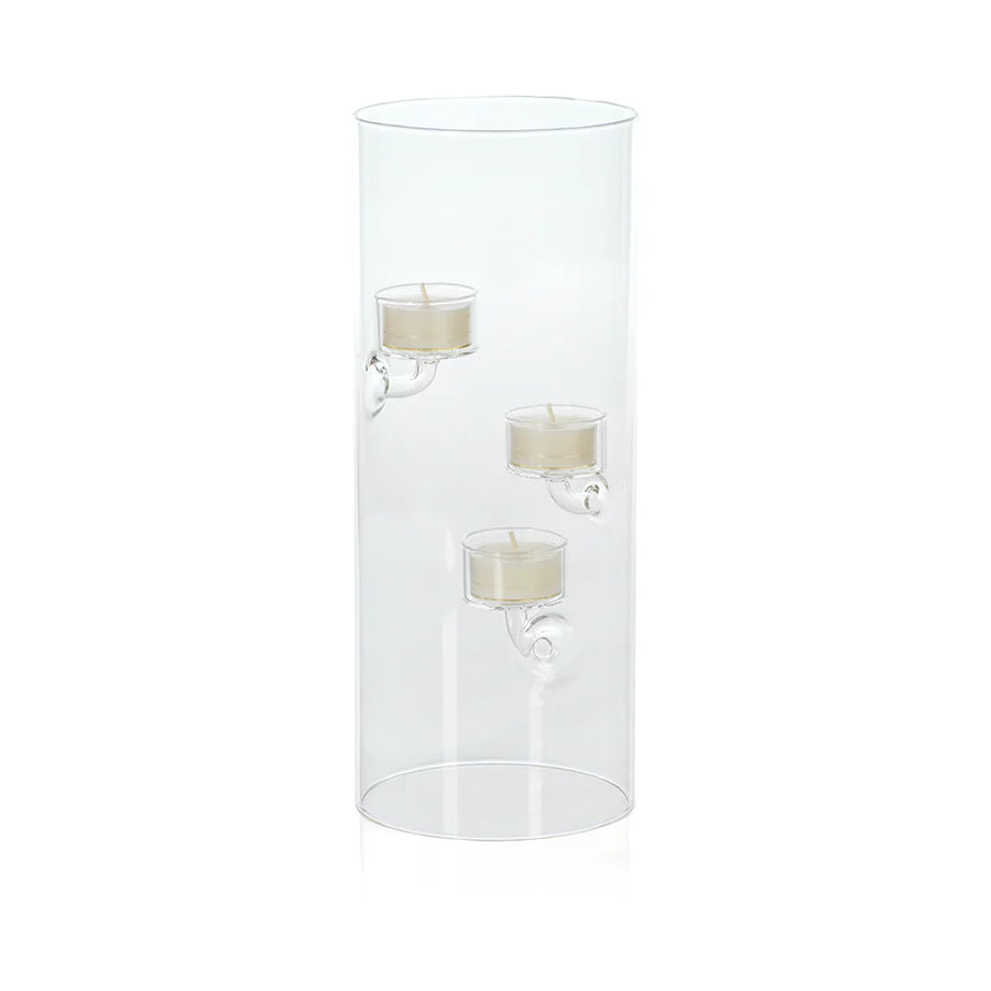 Clear cylindrical candle holder with three candles.