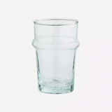 A clear glass tumbler with a thick base and a subtle flared shoulder.