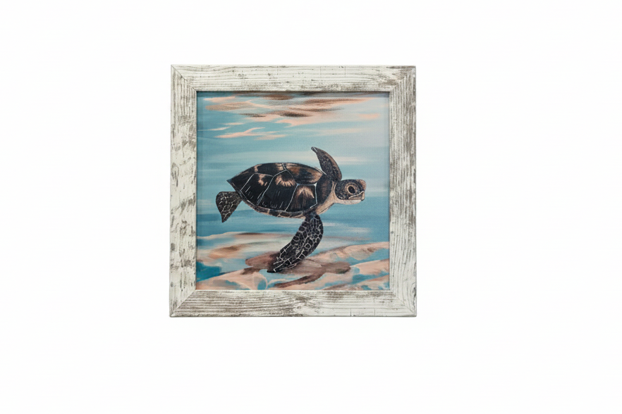 A framed painting of a sea turtle swimming in blue water with sandy shore details, set in a distressed white wood frame 