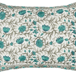 Floral-patterned pillow with teal flowers .