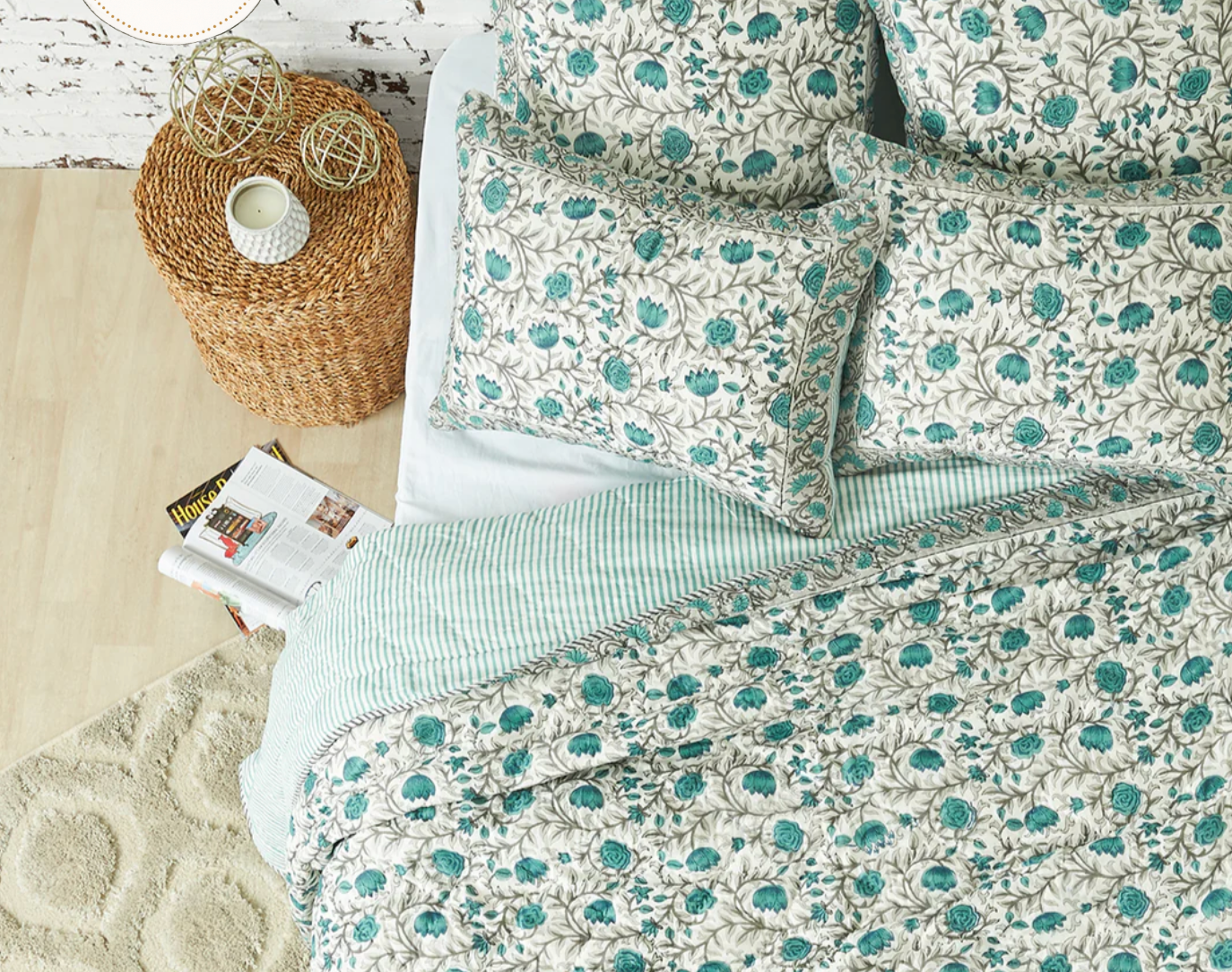 Floral-patterned bedding set on a bed.
