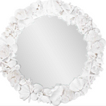 Round mirror with a decorative white shell frame.