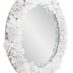 Decorative mirror with a white coral-like frame.