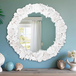 Decorative mirror with shell design.
